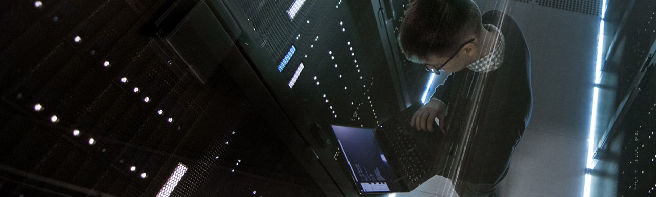 A person working in the data server room A person working in the data server room