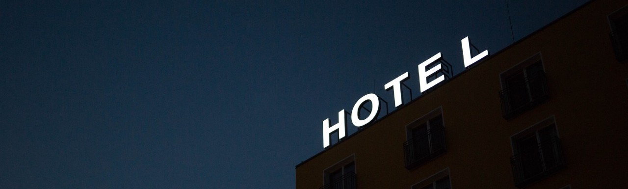 Hotel Sign lit up on top of a hotel building Hotel Sign lit up on top of a hotel building