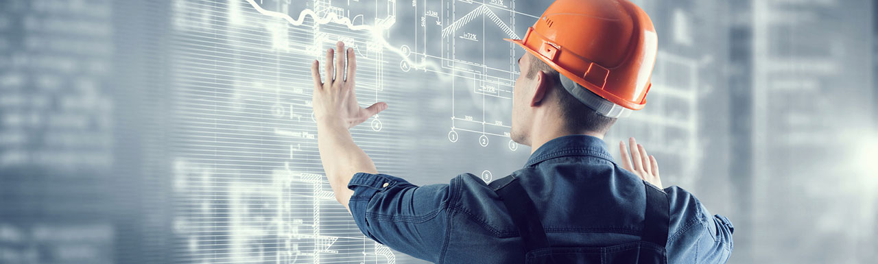 A construction engineer working on a large screen A construction engineer working on a large screen