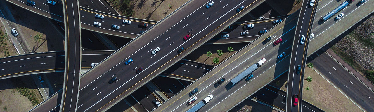 Many highways going above one another strategically with traffic passing through them Many highways going above one another strategically with traffic passing through them