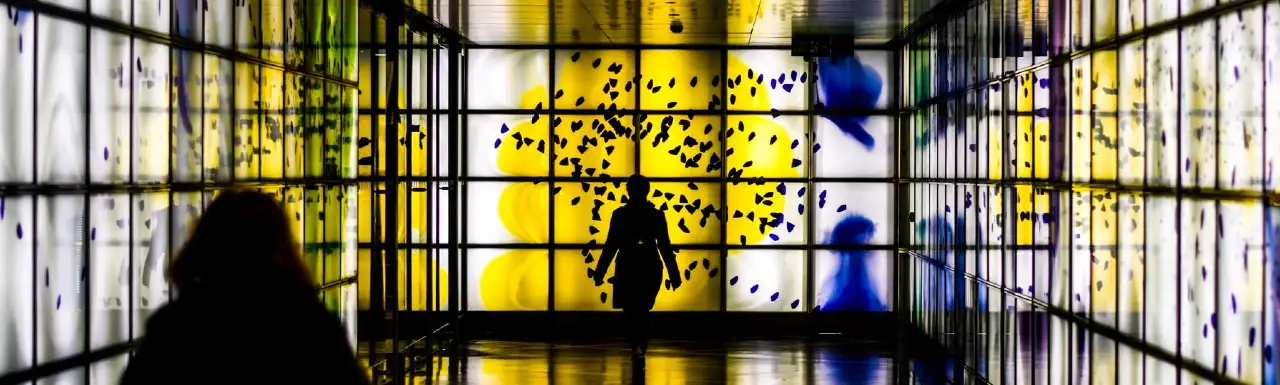 A digital art gallery and visitors in silhouette A digital art gallery and visitors in silhouette