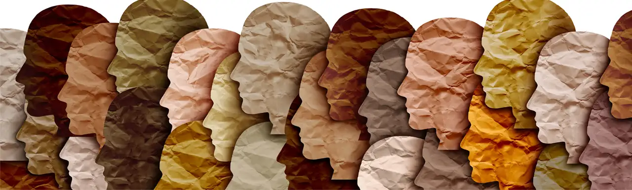 A few human faces made out of colored papers to symbolize various races and ethnicities A few human faces made out of colored papers to symbolize various races and ethnicities