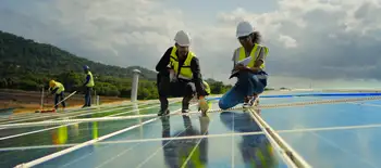 People looking at solar panels People looking at solar panels