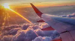 Sunrays coming from the back of a flying aero plane for aerospace